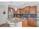 A gourmet kitchen featuring granite countertops, dark cabinetry, and a stainless steel refrigerator at 1807 Chauncy'S Ct, Mount Pleasant, SC 29466