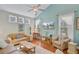 Bright and spacious living room featuring hardwood floors, a vaulted ceiling, and plenty of natural light at 1807 Chauncy'S Ct, Mount Pleasant, SC 29466