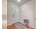 Clean entryway features hardwood floors, a white door, and decorative chest at 1822 Chatelain Way, Mount Pleasant, SC 29464