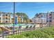 Resort-style pool area surrounded by beautifully landscaped grounds and seating at 1822 Chatelain Way, Mount Pleasant, SC 29464