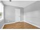 An empty bedroom with hardwood floors, a window, and fresh paint at 1873 Hazelwood Dr, Charleston, SC 29407