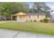 Charming single-story home with a well-maintained lawn and front porch at 1873 Hazelwood Dr, Charleston, SC 29407