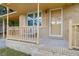 Inviting front porch with a cozy seating area, perfect for enjoying the outdoors and relaxing at 1873 Hazelwood Dr, Charleston, SC 29407