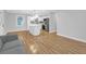 Modern open living area with stainless steel appliances, white cabinets and kitchen island with stylish lighting at 1873 Hazelwood Dr, Charleston, SC 29407