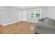 Bright living space featuring new flooring, a new paint job, a comfortable sofa, and natural light at 1873 Hazelwood Dr, Charleston, SC 29407