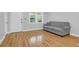 Living room featuring hardwood floors, a large window, and a comfortable couch at 1873 Hazelwood Dr, Charleston, SC 29407