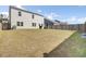 Backyard with a large grassy area, grill, seating area, and privacy fence at 203 Hayworth Rd, Summerville, SC 29486