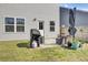 Backyard with a seating area, grill, privacy fence and grass at 203 Hayworth Rd, Summerville, SC 29486