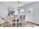 Cozy dining room with a modern chandelier, stylish furniture, and natural light at 203 Hayworth Rd, Summerville, SC 29486