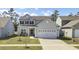 Charming two-story home with a well-manicured lawn, two-car garage, and welcoming curb appeal at 203 Hayworth Rd, Summerville, SC 29486