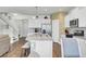 Bright kitchen features white cabinets, granite countertops, stainless steel appliances and a spacious center island with seating at 203 Hayworth Rd, Summerville, SC 29486