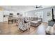 Open concept living room and kitchen with hardwood floors and ample space for entertaining at 203 Hayworth Rd, Summerville, SC 29486