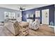 Stylish living room featuring a comfortable sofa, large television, and modern decor accents at 203 Hayworth Rd, Summerville, SC 29486