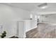 The open loft area features wood floors and plenty of natural lighting at 203 Hayworth Rd, Summerville, SC 29486