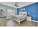 Comfortable bedroom featuring a ceiling fan, vinyl floors and colorful walls and decor at 203 Hayworth Rd, Summerville, SC 29486