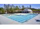 Community pool featuring a splash pad, covered seating, a bathhouse and palm trees in a shared community space at 203 Hayworth Rd, Summerville, SC 29486