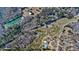 Aerial view of the property featuring trees, ponds, and the surrounding landscape at 212 Chester Ln, Cottageville, SC 29435