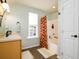 bathroom with oak vanity, shower/tub combo, and tile floor at 212 Chester Ln, Cottageville, SC 29435
