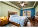 Cozy bedroom with a tray ceiling, a queen-size bed, and a large window provides a comfortable retreat for rest and relaxation at 212 Chester Ln, Cottageville, SC 29435