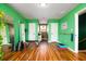 Home bonus room featuring a hardwood floor, mirrors, and gym equipment at 212 Chester Ln, Cottageville, SC 29435