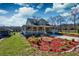 Charming two-story home with a welcoming front porch, landscaped yard, and well-maintained exterior at 212 Chester Ln, Cottageville, SC 29435