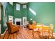Bright living room features high ceilings, a cozy fireplace, and comfortable seating for relaxation and entertaining guests at 212 Chester Ln, Cottageville, SC 29435