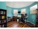 Home office with desk and shelving, plus lots of natural light from the two large windows at 212 Chester Ln, Cottageville, SC 29435