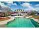 Backyard showcases a refreshing pool and patio, perfect for relaxation, with a charming home visible in the background at 212 Chester Ln, Cottageville, SC 29435