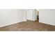 Bright bedroom with hardwood floors, white trim, and a bathroom at 2196 Macallan Blvd, Ravenel, SC 29470