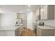 Bright kitchen with an island, gray cabinets, and stainless steel appliances at 2196 Macallan Blvd, Ravenel, SC 29470
