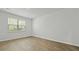 Bedroom featuring plank flooring and a large window that offers natural light at 2275 Macallan Blvd, Ravenel, SC 29470