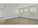 A bright bedroom featuring plank floors, a sliding glass door, and lots of sunlight at 2275 Macallan Blvd, Ravenel, SC 29470