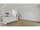 Modern kitchen featuring grey cabinets, stainless steel appliances, and a spacious center island at 2275 Macallan Blvd, Ravenel, SC 29470