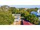 Aerial view of home surrounded by lush greenery and marsh at 2314 Goldbug Ave, Sullivans Island, SC 29482