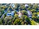 Aerial view showcasing houses among trees with a street going through the neighborhood at 2314 Goldbug Ave, Sullivans Island, SC 29482