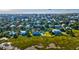 Expansive aerial view features large homes with pools, near a marsh and the ocean at 2314 Goldbug Ave, Sullivans Island, SC 29482