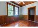 Bedroom features wood paneling and hardwood floors at 2314 Goldbug Ave, Sullivans Island, SC 29482