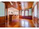 Bright living room with hardwood floors and view into kitchen area with breakfast bar at 2314 Goldbug Ave, Sullivans Island, SC 29482