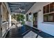 Enclosed porch has ceiling fan and screened windows at 2314 Goldbug Ave, Sullivans Island, SC 29482
