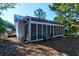 Exterior view of screened porch with white railings and bench at 2314 Goldbug Ave, Sullivans Island, SC 29482