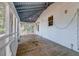 Spacious screened porch with wood flooring and white walls at 2314 Goldbug Ave, Sullivans Island, SC 29482