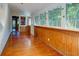 Bright sunroom featuring wood paneling, and natural light at 2314 Goldbug Ave, Sullivans Island, SC 29482