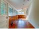 Bright sunroom with wood accents and plenty of natural light at 2314 Goldbug Ave, Sullivans Island, SC 29482