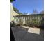 Backyard patio view with partial fence and established bushes at 2326 Treescape Dr # 2, Charleston, SC 29414