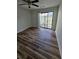 Bedroom featuring new hardwood floors and sliding glass doors to outdoor patio at 2326 Treescape Dr # 2, Charleston, SC 29414