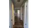 Hallway with hardwood flooring, views of multiple rooms and a laundry closet at 2326 Treescape Dr # 2, Charleston, SC 29414
