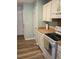 Bright kitchen with white cabinets, wood counters, modern floors and essential appliances at 2326 Treescape Dr # 2, Charleston, SC 29414