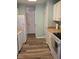 White kitchen featuring modern floors, white appliances and a wood countertop at 2326 Treescape Dr # 2, Charleston, SC 29414