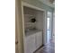 Bright laundry area with side by side washer and dryer and additional shelving at 2326 Treescape Dr # 2, Charleston, SC 29414