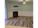 Living room showcasing modern vinyl floors, a charming fireplace and neutral paint at 2326 Treescape Dr # 2, Charleston, SC 29414